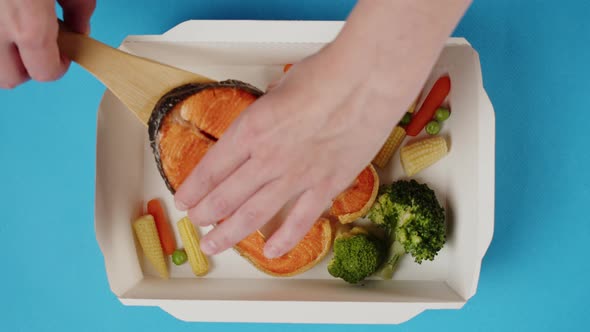 Food Delivery Top View Take Away Meal in Disposable Container on Blue Background alt