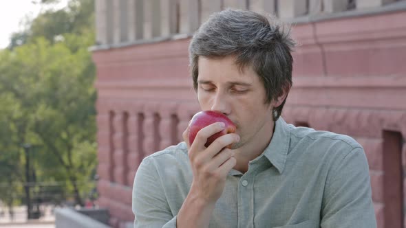 Male Vegan Vegetarian Enjoying Healthy Vitamin Food Dieting Guy Sniffs Fragrant Fruits Closes Eyes alt