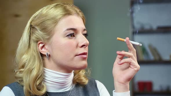 Female Thinking About Her Life and Smoking a Cigarette. Unhealthy Lifestyle alt