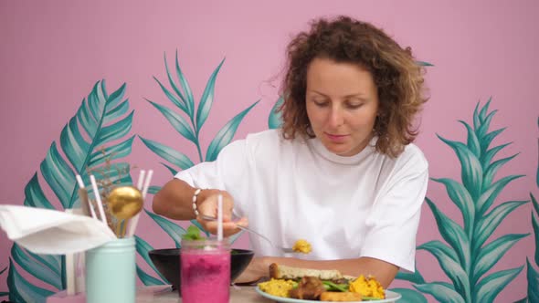 Young Blonde Woman Eating Her Healthy Delicious Vegan Breakfast alt