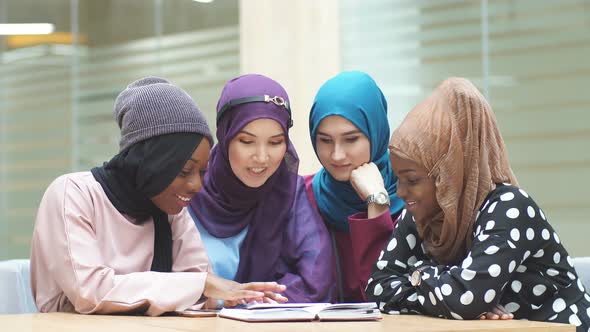 Islamic Female Travel Blogger Sharing Info From Smartphone with Her Followers alt