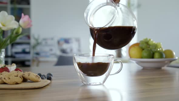 Pouring Coffee In To Cup