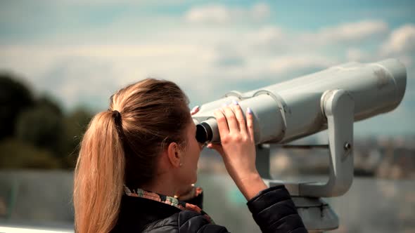 Tourist Female Look In Tower Viewer In New Weekend Trip. Girl Looking Through Binoculars In Town. alt