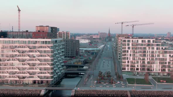 Drone Panning Shot of Buildings in Aarhus Revealing the Majestic Sea Waters at the End of the Clip alt