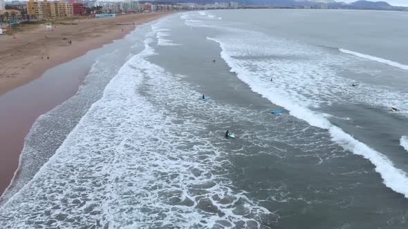 Surf training, Pacific Ocean (La Serena, Chile) aerial view, drone footage