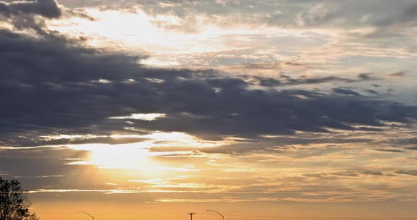 Sunrise Sky Blue Orange Light of the Sun Through the Clouds in the Sky alt
