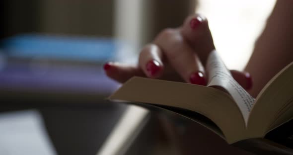 Reading book close-up slowmotion