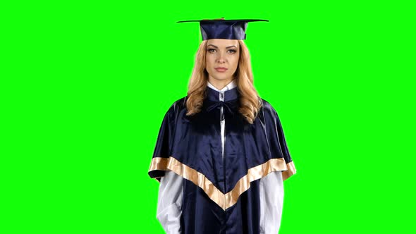 Graduate Threatening Finger and Shows Sign Quietly. Green Screen alt