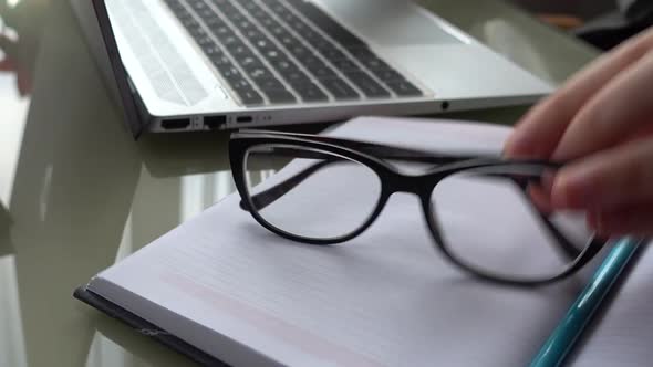 The girl working at home office hands on keyboard. alt
