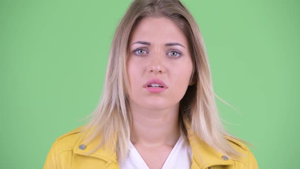 Face of Stressed Young Rebellious Blonde Woman Looking Sad and Crying alt