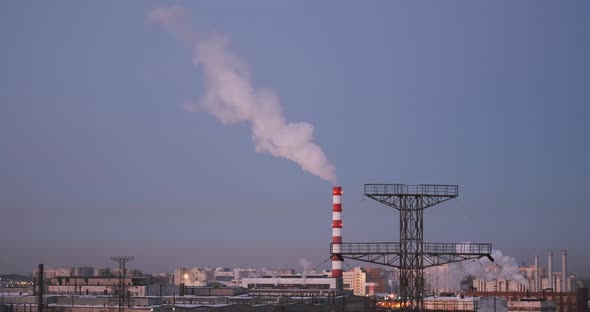 Tube with Smoke in Industrial Area Polluting the Air of City