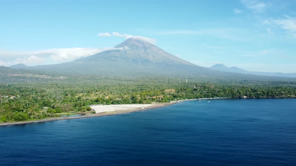 Fly Along Black Sand Beach with Volcano Mountains alt