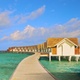 4K Wooden bridge leading to overwater bungalows on a Maldives Island resort in slow motion - VideoHive Item for Sale