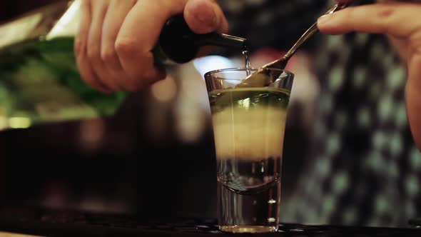 Barman prepares alcoholic cocktail, close up
