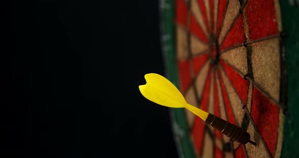 Arrow on dart against black background alt