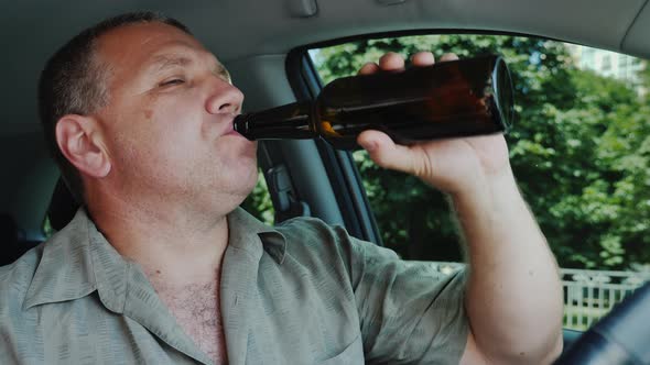 The Driver Drinks Alcohol at the Wheel, Dangerous Illegal Behavior Concept alt