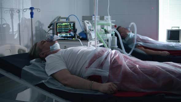Two Patients Are Connected To a Respiratory Medical Device. Coronavirus, Covid-19 Infected Patients alt
