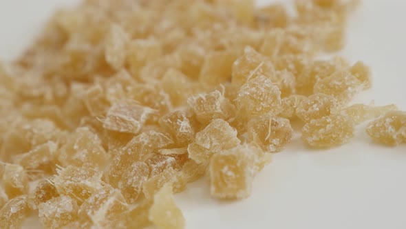 Pile of Candied ginger root on the table  close-up slow tilt 4K 2160p 30fps UltraHD footage - Crysta alt