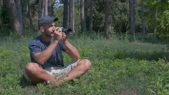 Man take photo in park.  alt