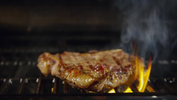 T-Bone Beef Steak On A Grill With Flames 40