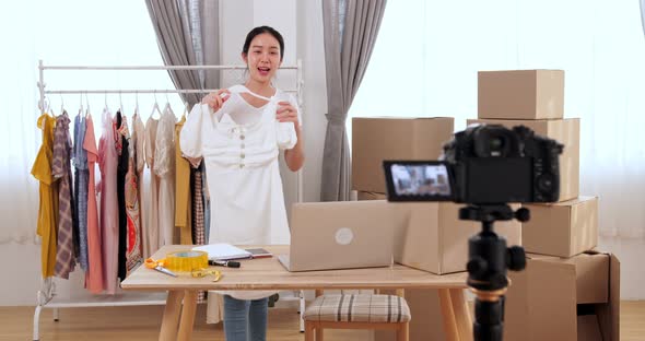 Girl Recording Her Video Blog About Cocktail Dress At Home alt