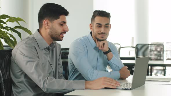 Confident Arabic Male Financial Consultant Adviser Expert Talking to Indian Client Customer Explain alt