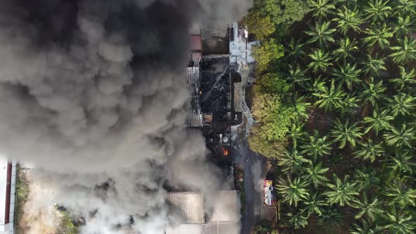 Aerial view black smoke due to fire alt