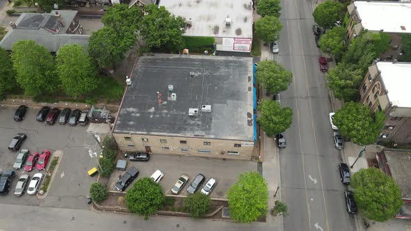 Flyover of well established older neighborhood in Minneapolis, Minnesota. Trees along the street.