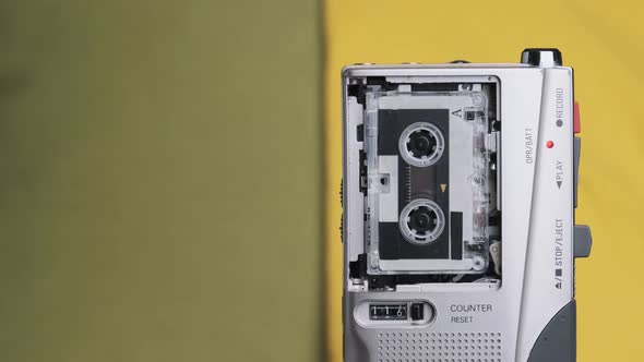 Portable Retro Tape Recorder with Micro Cassette Rec Sound on Yellow Background alt