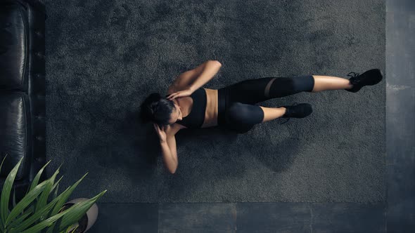 Top View of Woman Exercising on the Floor at Home, Overhead Woman Doing Fitness Training at Home alt