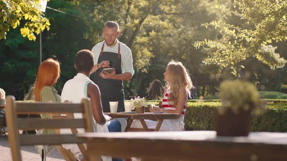 A Tall Broad Shoulder Sexy Waiter is Writing Down alt