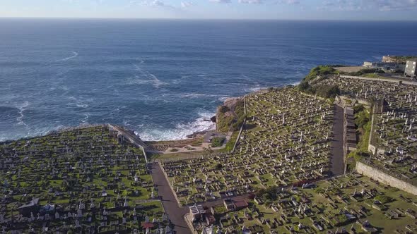 Graveyards on the cliff with spectacular Pacific Ocean view, aerial forward flying over most popular alt