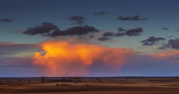 Cumulonimbus Storm Clouds at Sunset.  UHD Timelapse