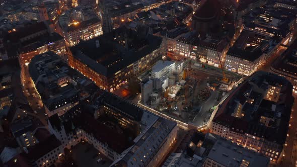 Huge Construction Building Site in Urban Environment City Center of Munich, Germany at Night with alt