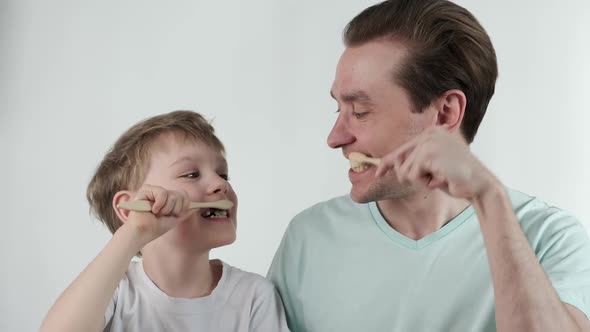 Father and Son Teeth Brushing