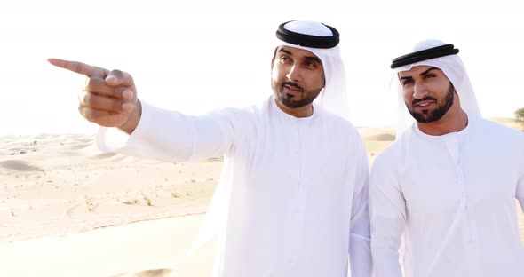 Men with traditional outfit  in the desert alt