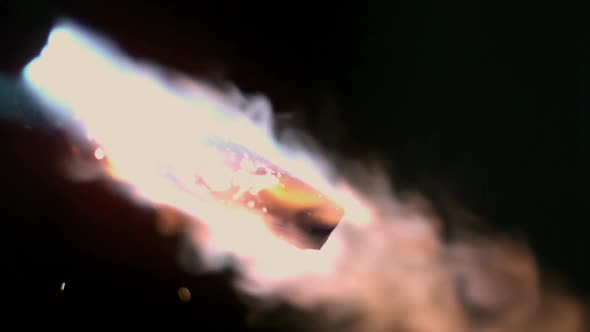 Flame from torch heating up piece of metal alt