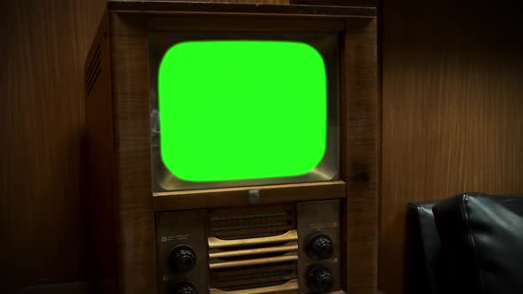 1950s TV Green Screen against Wooden Wall. Zoom Out. alt