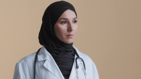 Portrait of Pensive Upset Muslim Arabian Young Woman Doctor Islamic Gynecologist Scientist Physician alt