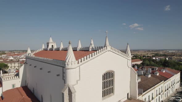 Aerial orbiting over São Francisco Church ornamented Rooftop, Evora