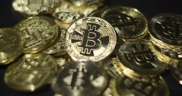 Cryptocurrency Real Golden Coins With Bitcoin Logo On Black Background alt