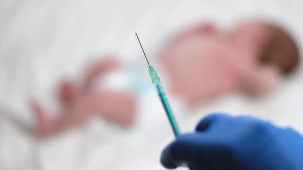 Pediatrician Vaccinating Newborn Baby alt
