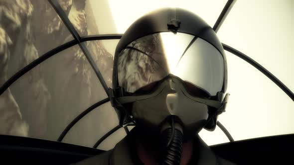The pilot wearing a helmet and a mask in the cockpit is flying a jet fighter. alt
