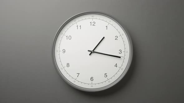 Clock Face on Dark Grey Office Wall