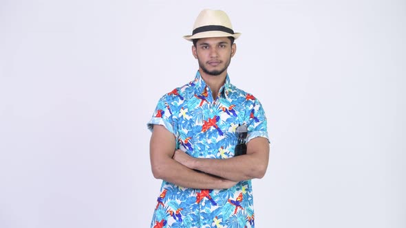 Young Handsome Bearded Indian Tourist Man with Arms Crossed alt
