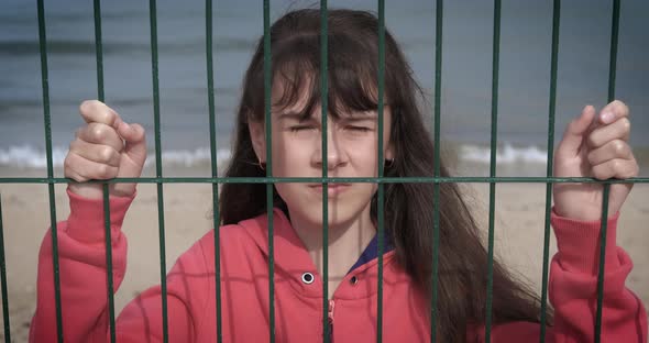 Stressed Girl on Closed Beach alt