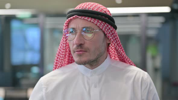 Middle Aged Arab Man Looking Around, Searching alt