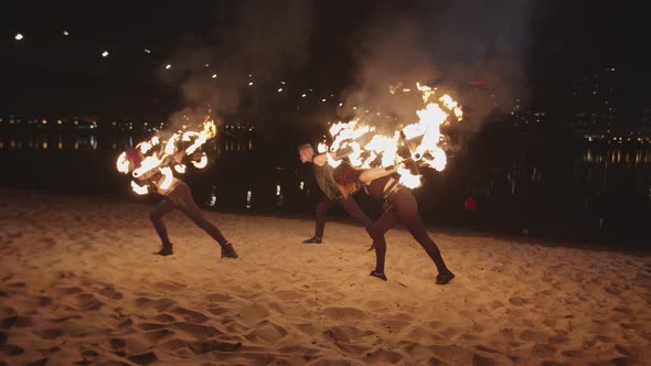 Artists Performing Stunt with Rolling Staves alt