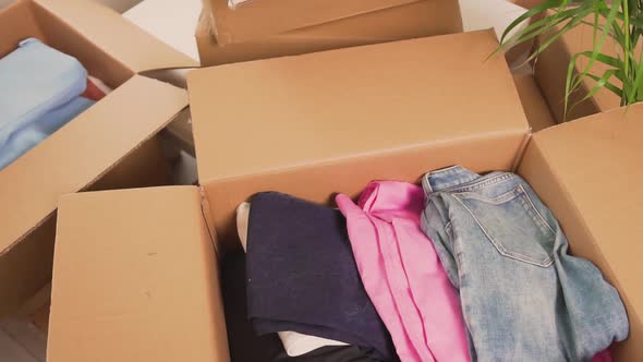 Closeup of a Box of Clothes After Moving in