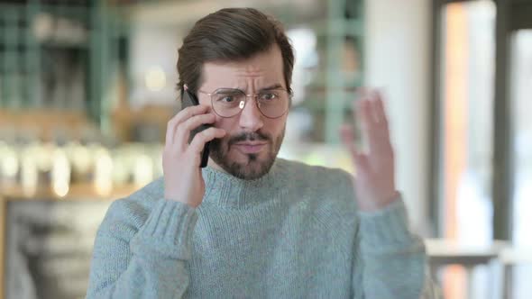 Creative Old Man with Laptop Pointing at Camera alt